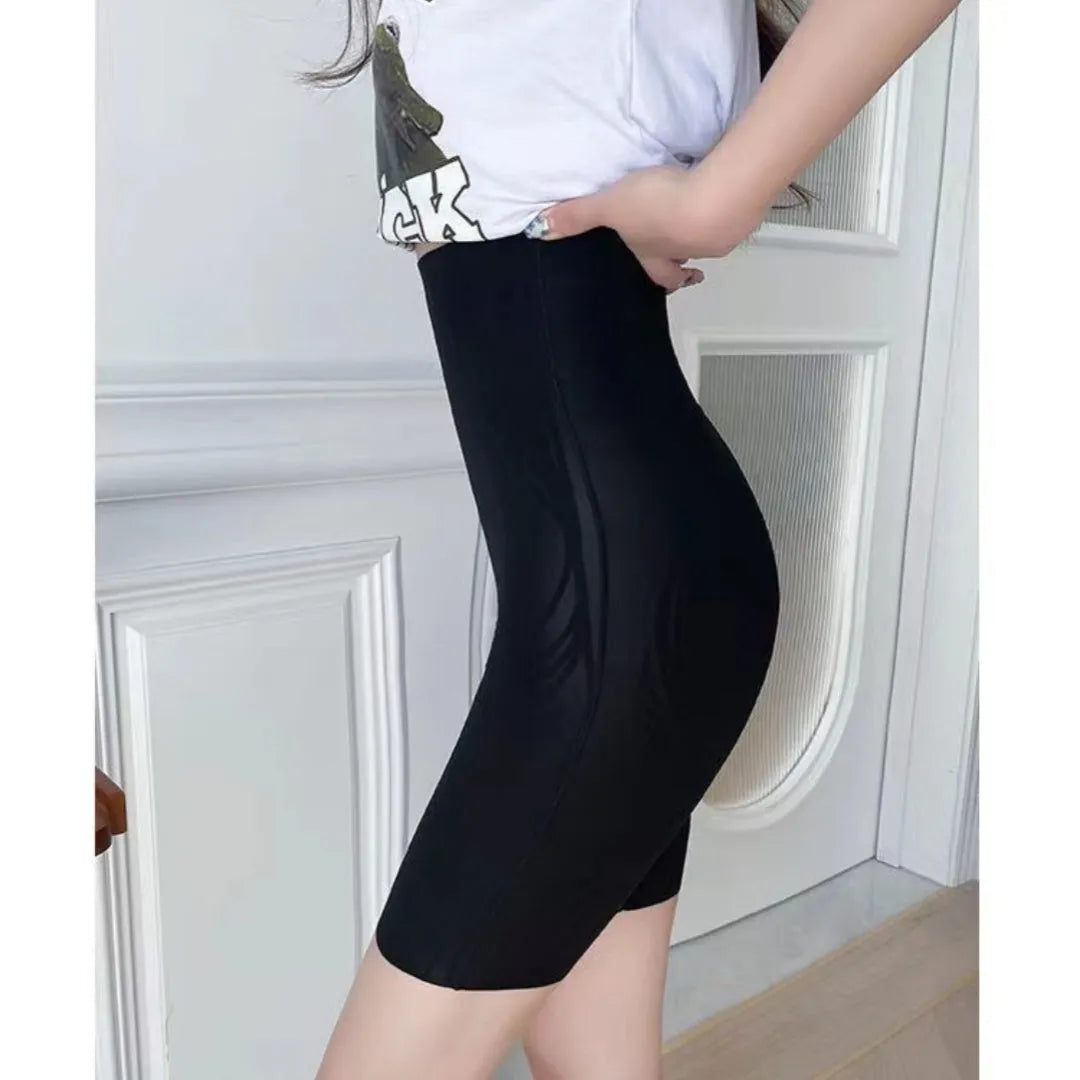 Women's liquid seamless high waisted nylon tight pants in black, with hip lifting and belly control function