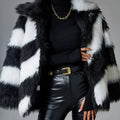 Women's faux fur coat with contrast lapel and detachable fur collar on a hanger.
