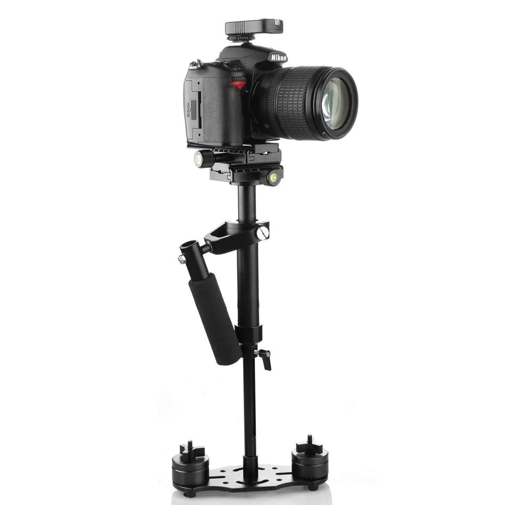Black aluminium handheld camera stabiliser with adjustable height on a table.