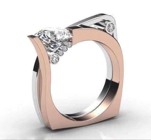 A pair of rose gold geometric couple rings with inlaid zircon stones on a white background.
