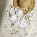 Women's halter neck lace-up bikini swimsuit in milky white, green, or white with briefs bottom
