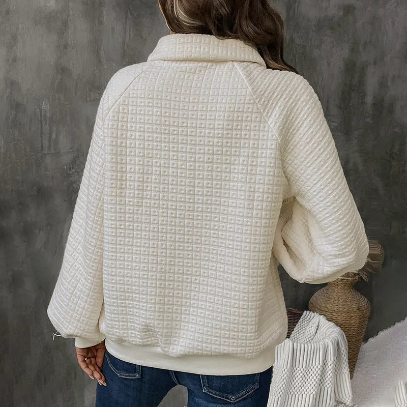 Women's milky white thick knit sweater with a polo collar.