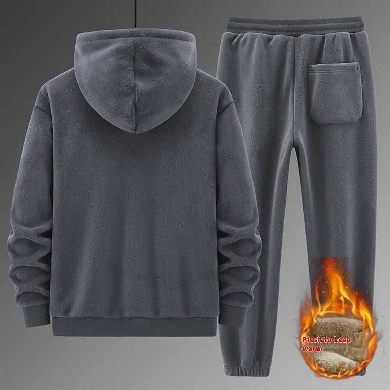 Grey cashmere-blend hooded sports jacket and matching full-length trousers laid flat.