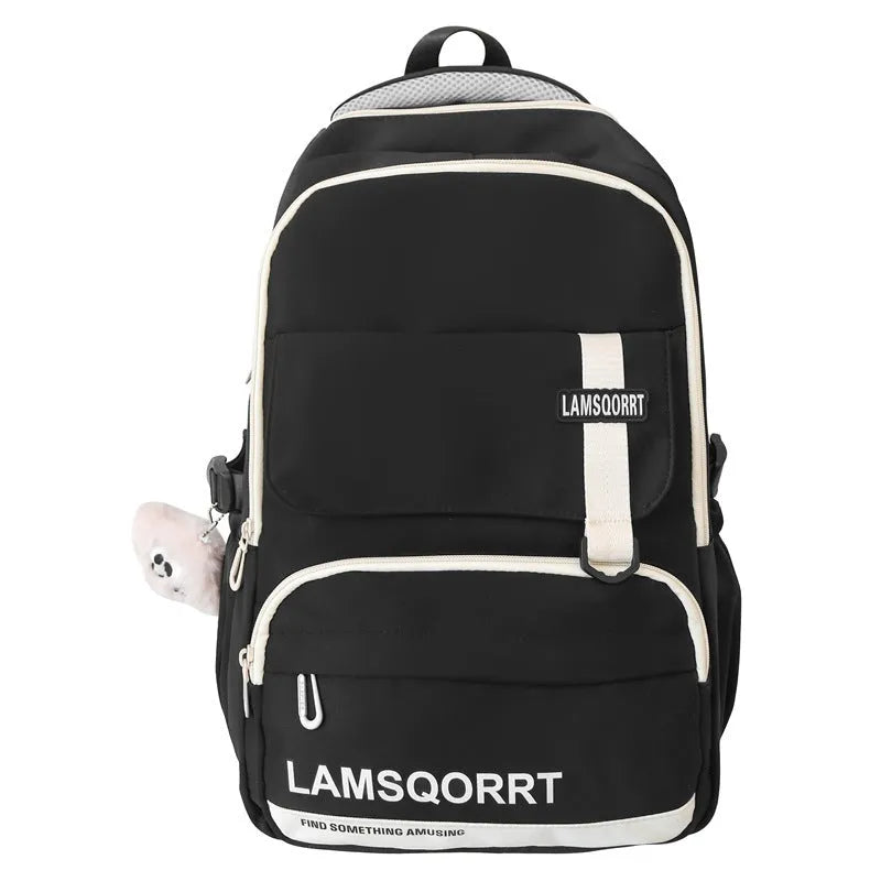 Waterproof nylon school backpack in colour options with curved shoulder straps and pendant attachment