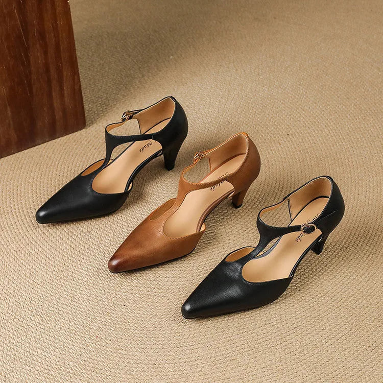 Brown retro women's T-strap sandals with a closed toe, block heel, and adjustable buckle.