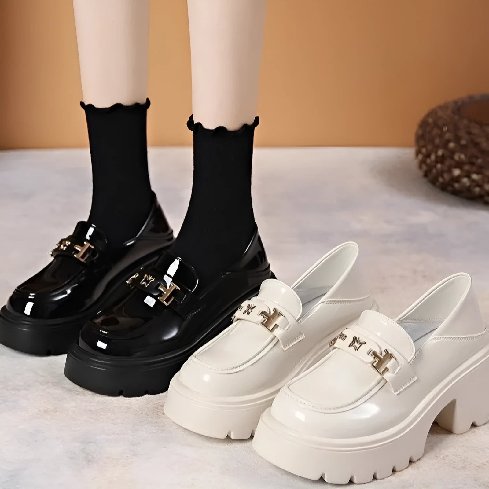 Black slip-on shoes with chunky square heel, round toe, and skull pattern on EVA upper