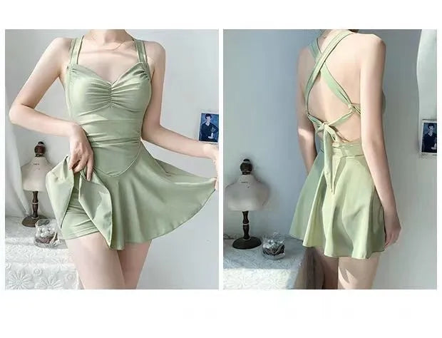 Women's solid colour one-piece boxer swimsuit in avocado green, featuring a backless and tight conservative style.