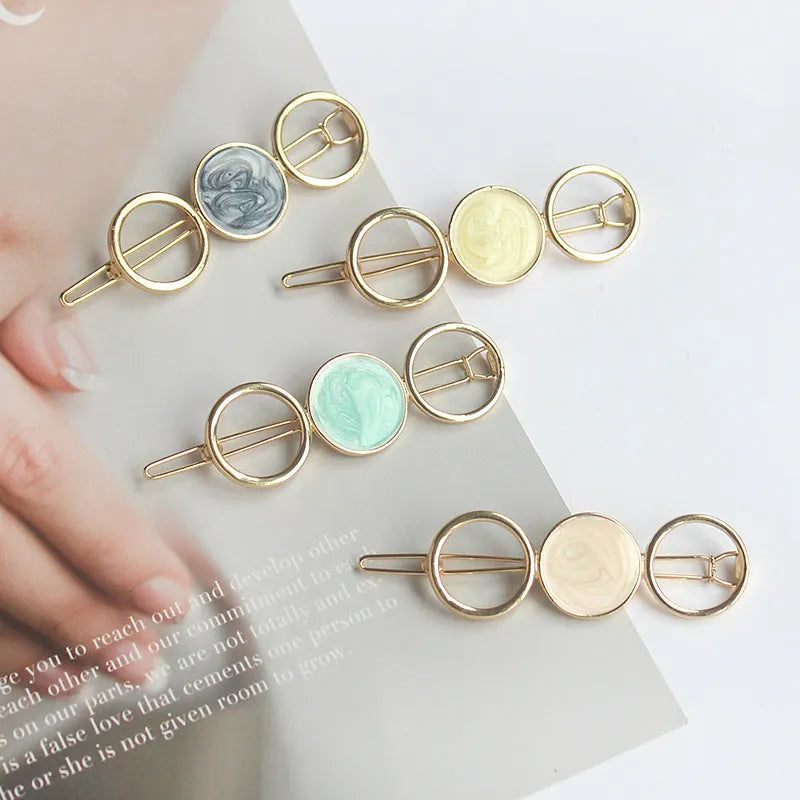 Round metal hairpin with opal crystal centre in beige colour, 7cm alloy construction