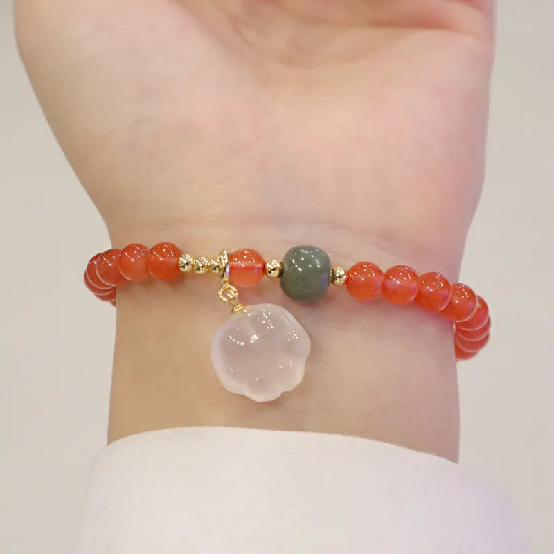 Women's bracelet with 8mm red agate cat's paw beads on a 6mm band.