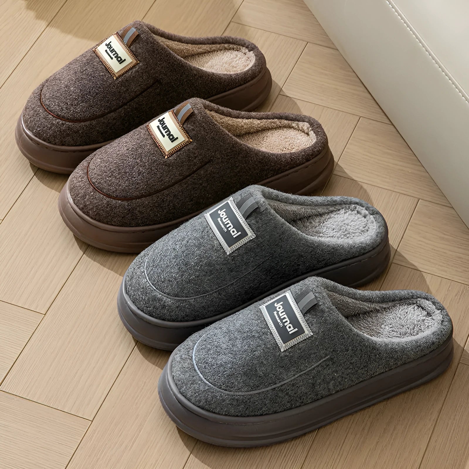 Men's grey suede slippers with a thickened sole shown on a wooden floor.