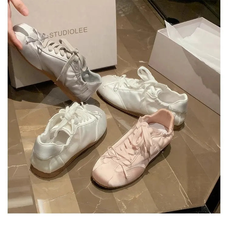 Women's silver grey satin ballet style sports board shoes with round toe and front lace-up design