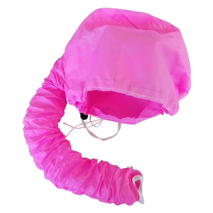 Pink hair dryer bonnet hood with drawstring on a head, attached to a hair dryer nozzle for styling