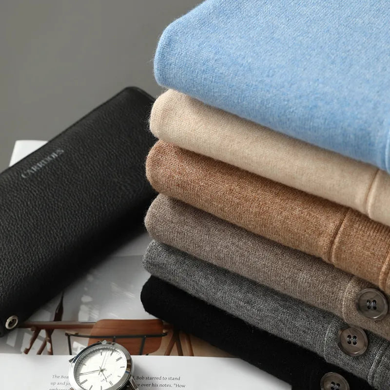 Man wearing a beige Andy velvet V-neck cardigan coat with long sleeves.