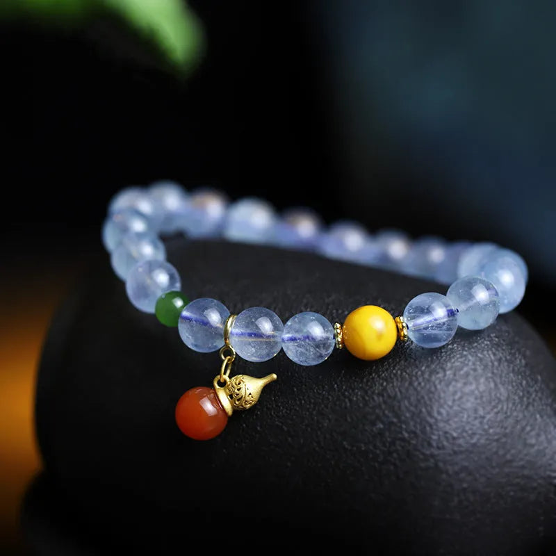 Iced aquamarine crystal bracelet with 8mm geometric beads and retro ethnic styling details