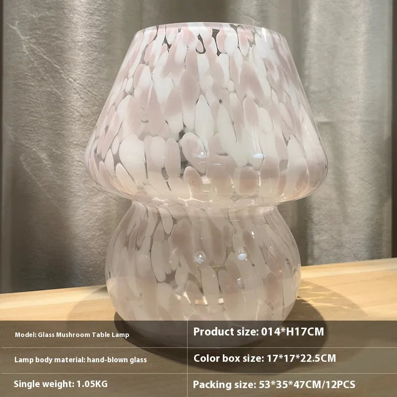 Flame mushroom pink and white glass mushroom table lamp with USB power and three-color light on a bedside table