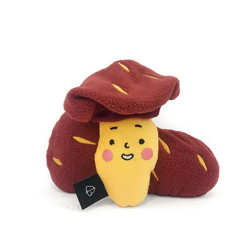 Red sweet potato pet toy with peelable exterior revealing hidden food pocket for treat dispensing