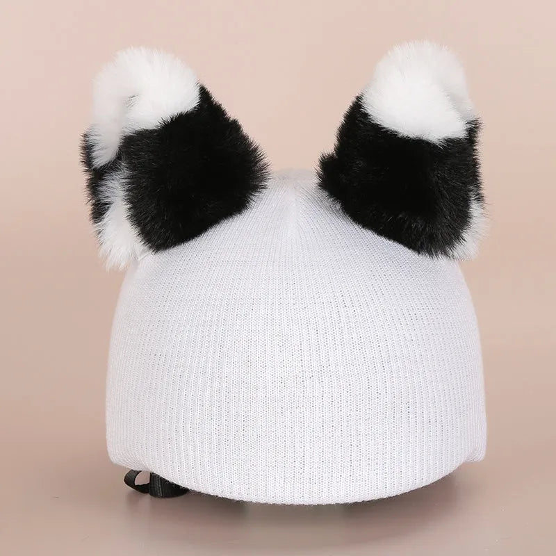 Soft plush cartoon hat decoration designed to stretch over a ski helmet for personalisation.