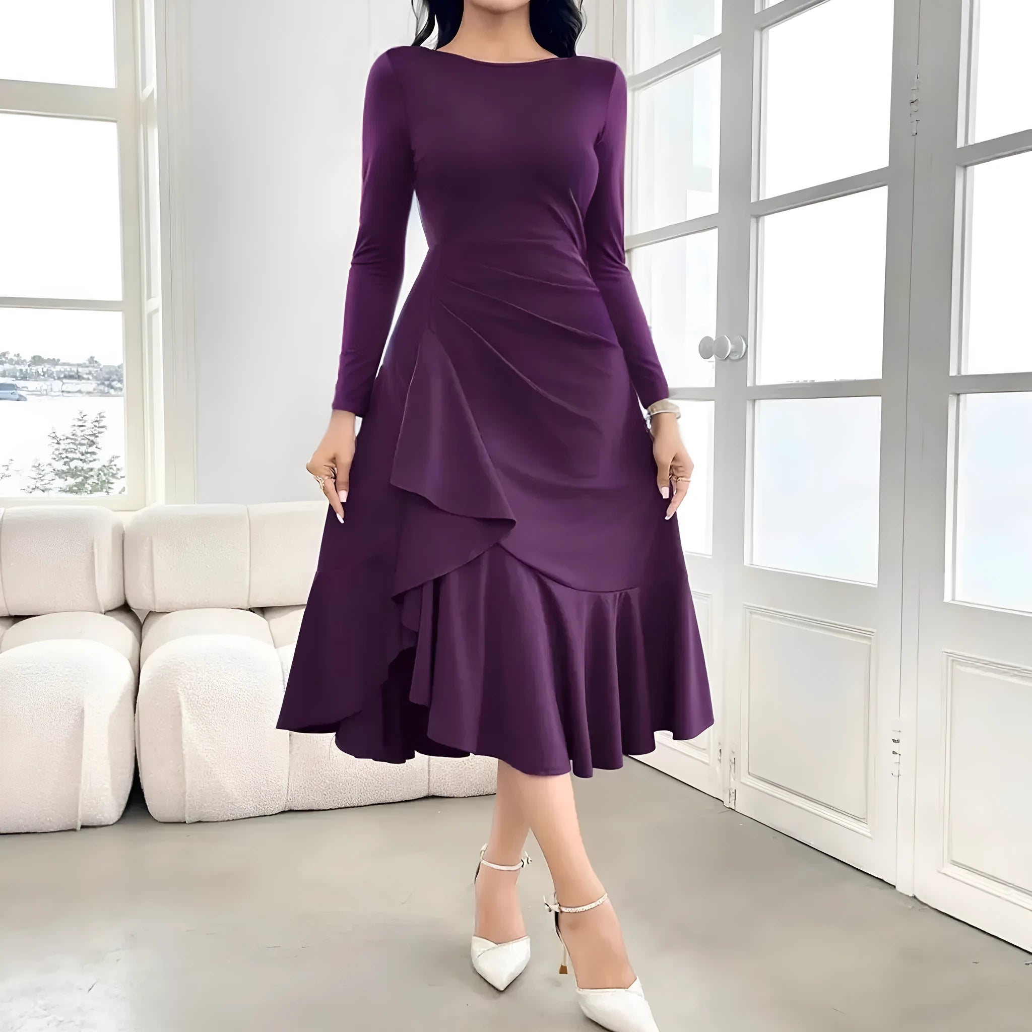 Purple women's long sleeve dress with ruffle detail and a round neck, shown on a model.