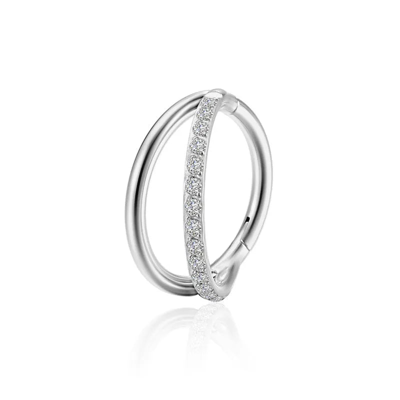 Titanium alloy straight barbell nose ring in silver with diamond detail on a grey background.