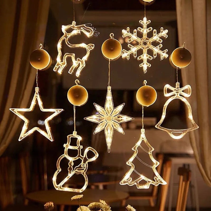 LED suction cup chandelier with Santa Claus, elk, and snowman shapes hanging on a window