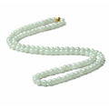 Natural A-level jade bead necklace with white and green round beads on an adjustable chain.