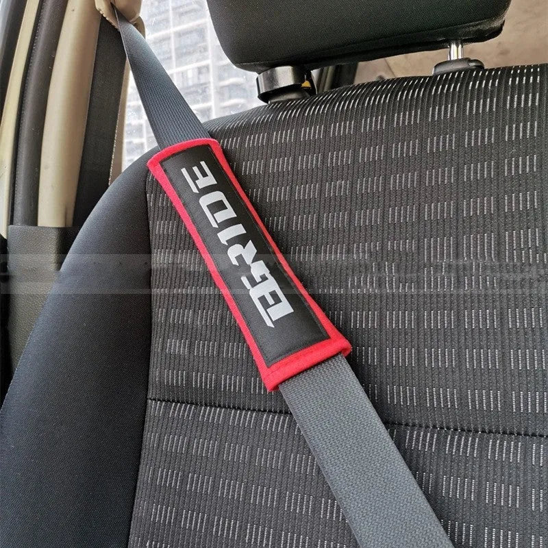 Car safety belt shoulder pad set in black, blue, or red colours, made from cotton sponge cloth.