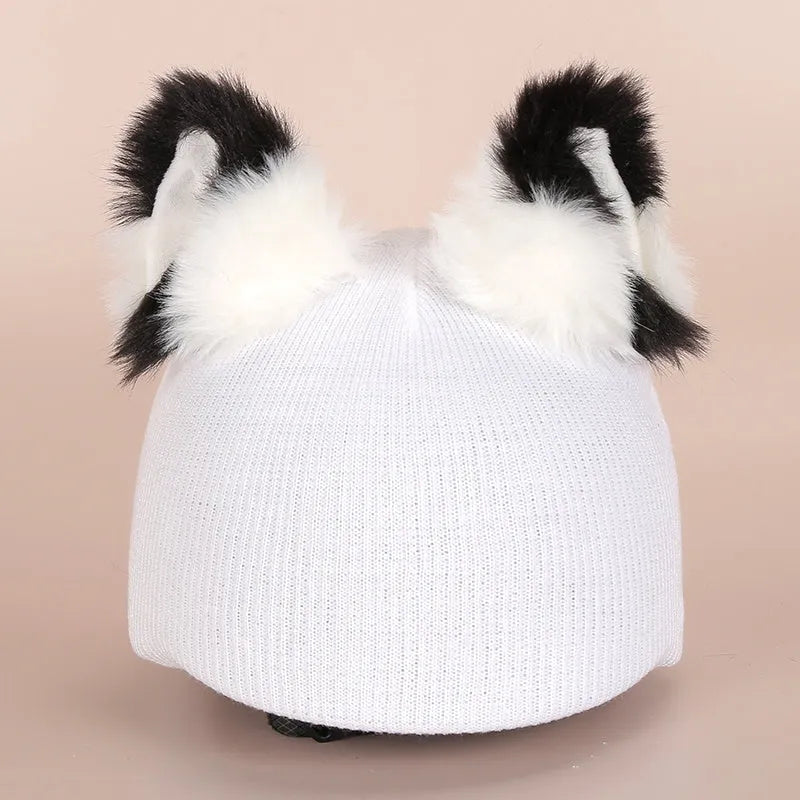 Soft plush cartoon hat decoration designed to stretch over a ski helmet for personalisation.