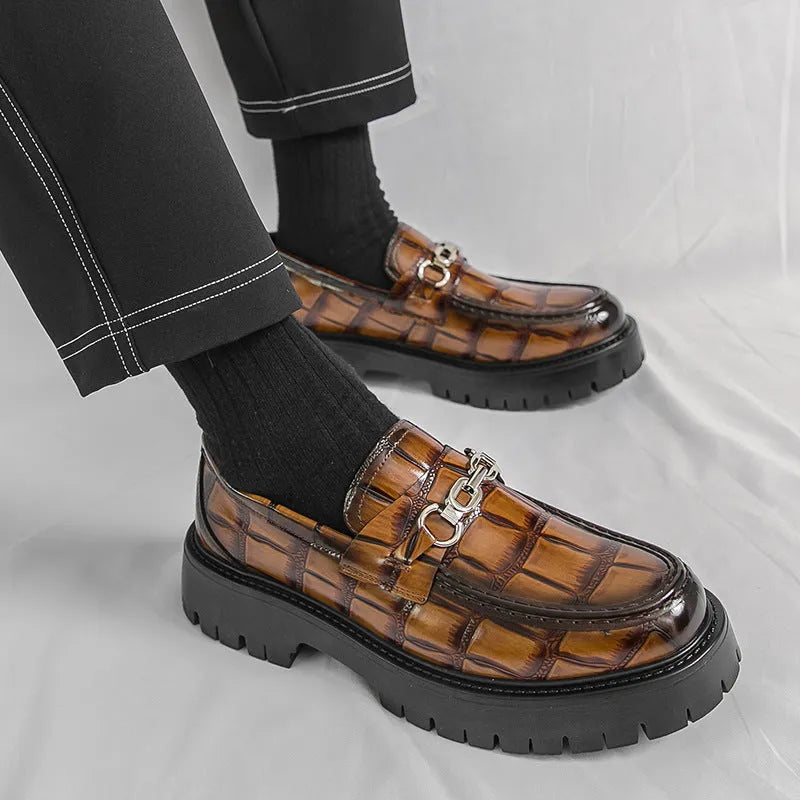 Men's crocodile print platform loafers in black, brown and yellow colours showing textured leather and flat heel design