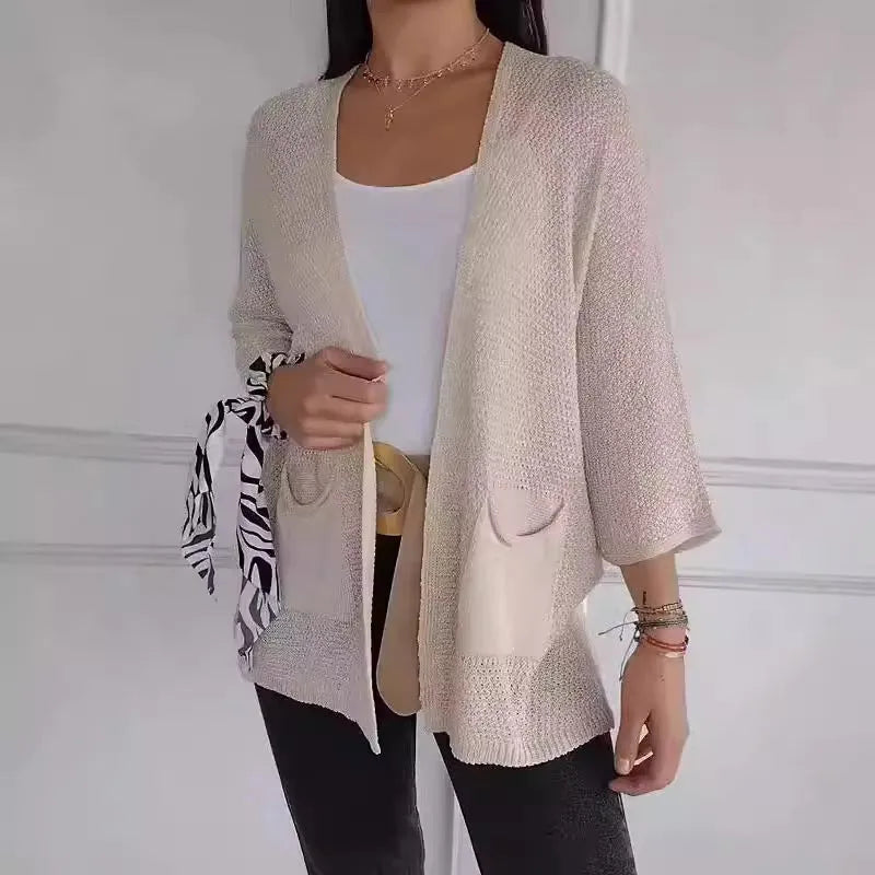 Women's waffle-textured cardigan coat in army green with nine-quarter sleeves and front pockets.