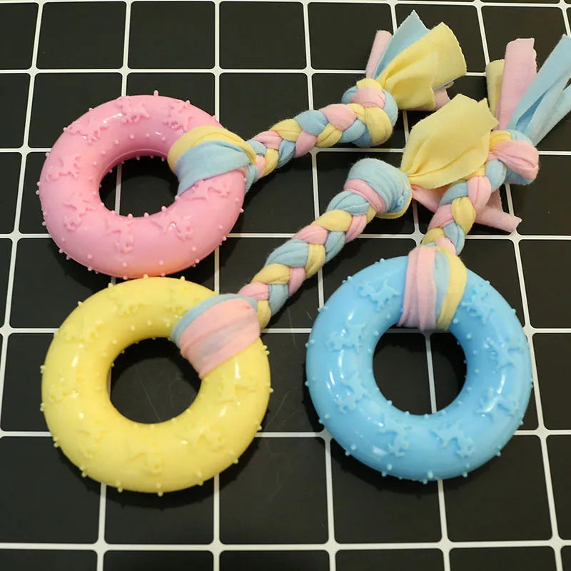 Non-toxic rubber dog training toy in star shape with teeth-cleaning surface design, available in pink blue and yellow