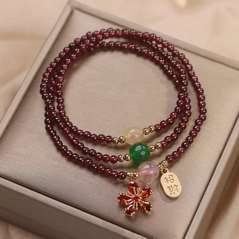 Women's natural crystal bracelet in pomegranate red cherry blossom colour with sequins detailing