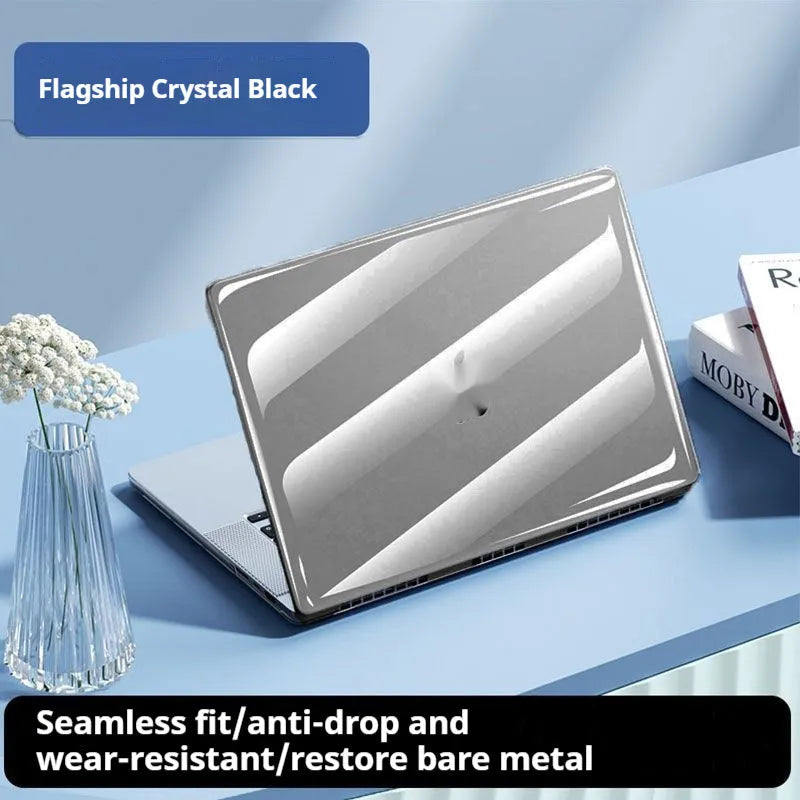 Transparent plastic protective shell for a MacBook laptop on a table.