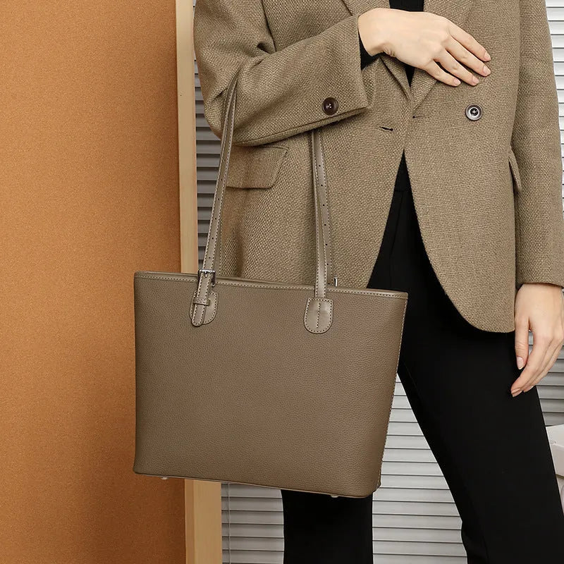 Genuine leather women's tote bag in horizontal square shape showing internal organisers and sandwich pocket