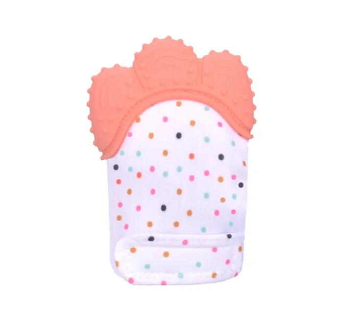 BPA-free silicone baby teether glove fastened with a white Velcro strap on a baby's hand