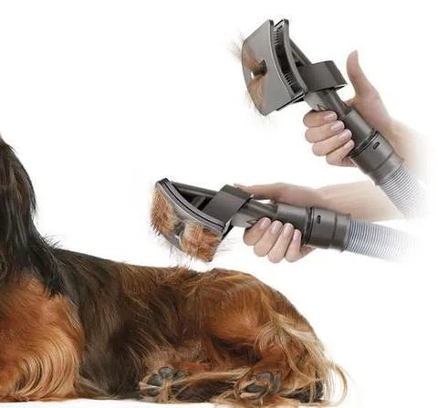 Deep grey pet grooming brush tool with vacuum attachment, 17 x 10 cm, on a plain background