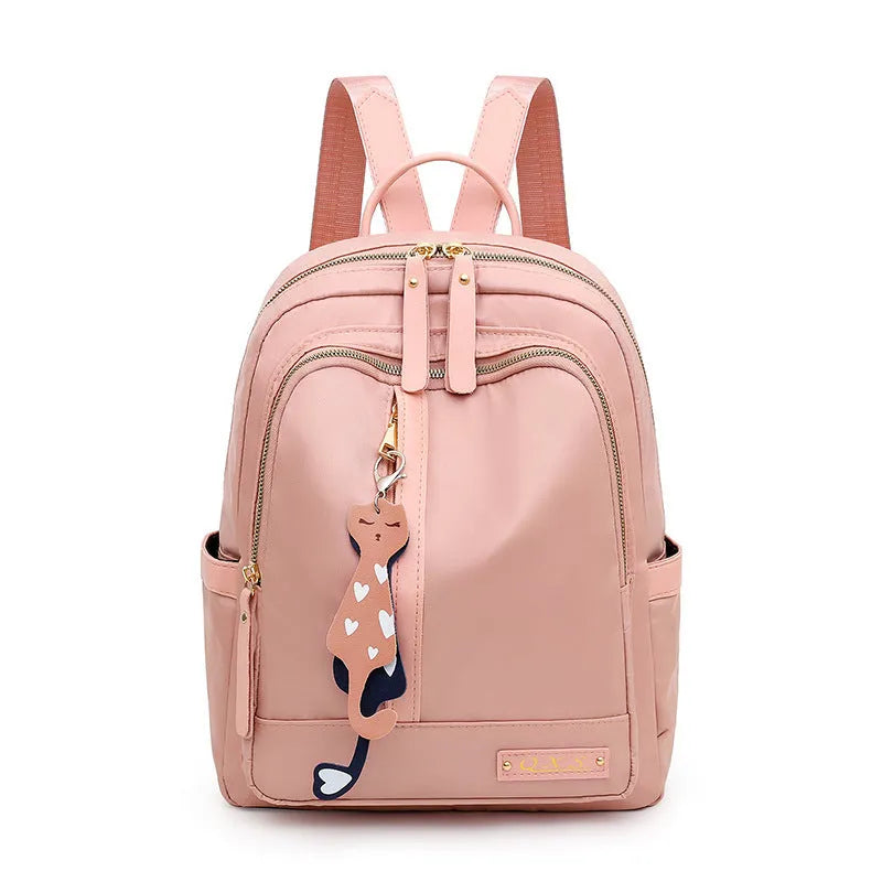 Black square nylon casual backpack with double shoulder straps and a front pocket.