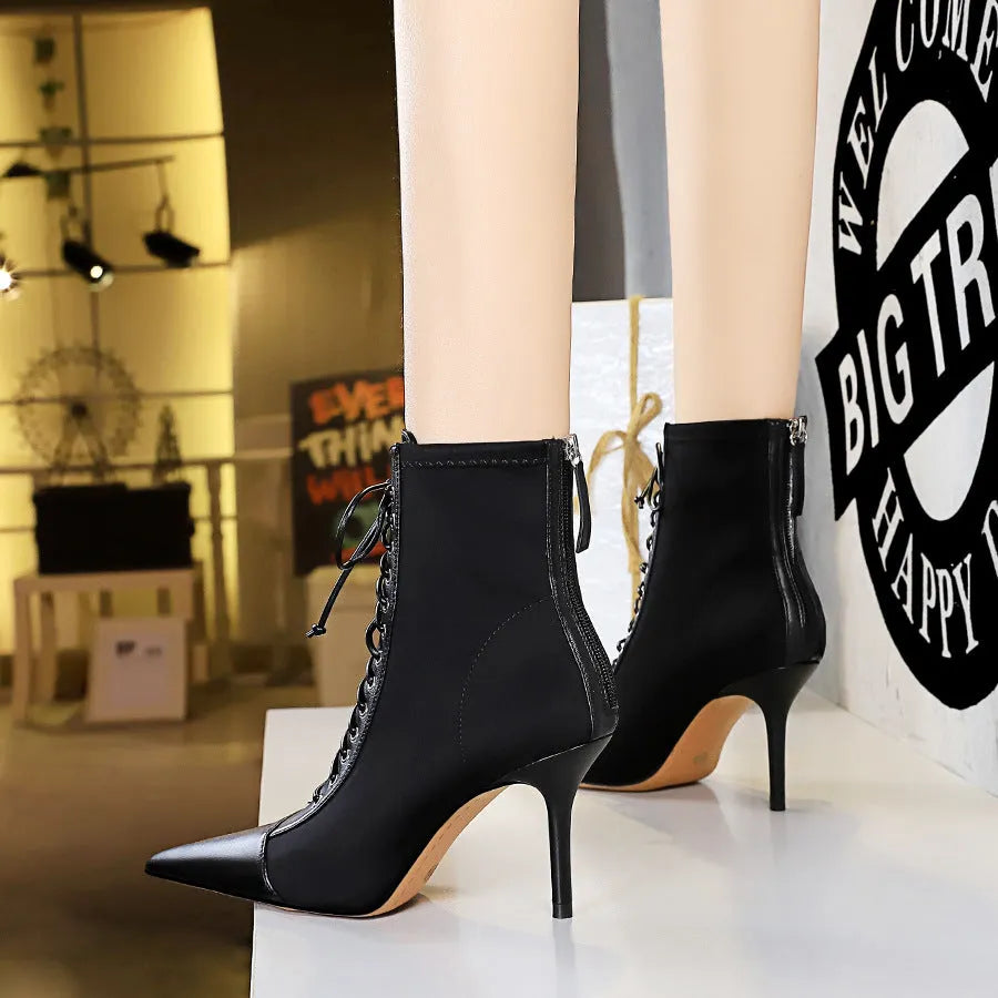 Black women's stiletto heel boots with pointed toe, back zipper, and 6-8CM heel, solid colour