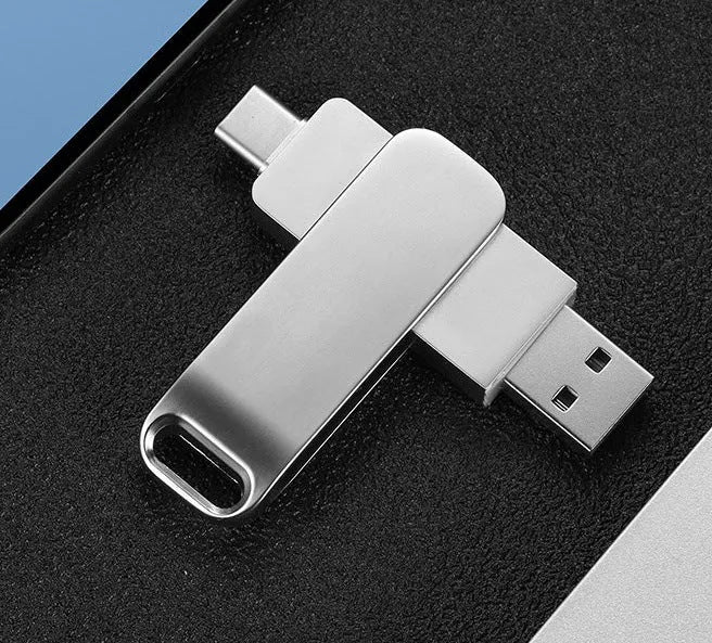 Rotating metal USB flash drive showing black and silver colour options with Type-C and standard USB connectors