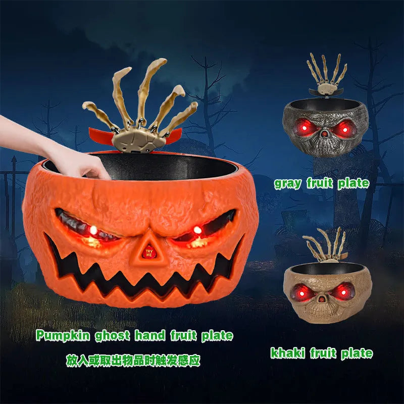 Motion activated Halloween candy bowl plastic pumpkin shape with skeleton hand and glowing red eyes
