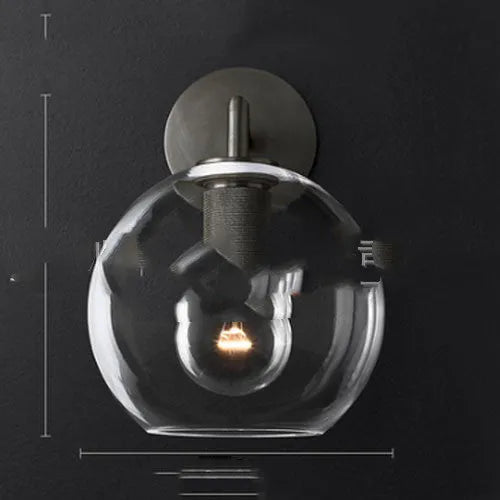 Modern wrought iron glass wall lamp with gold bronze finish and triangular transparent glass shade