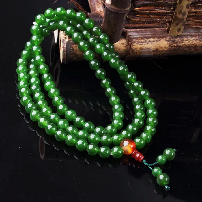 8mm quartz jade rosary bracelet with Buddha head bead on wrist