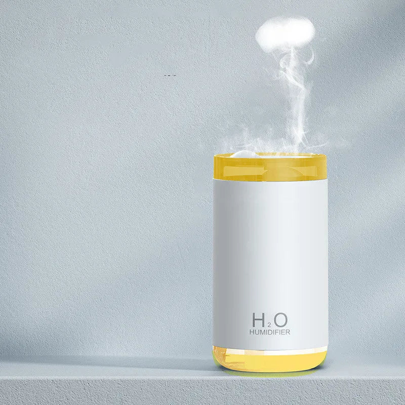 Jellyfish-shaped smoke ring humidifier with warm night light in white, pink, or blue colours