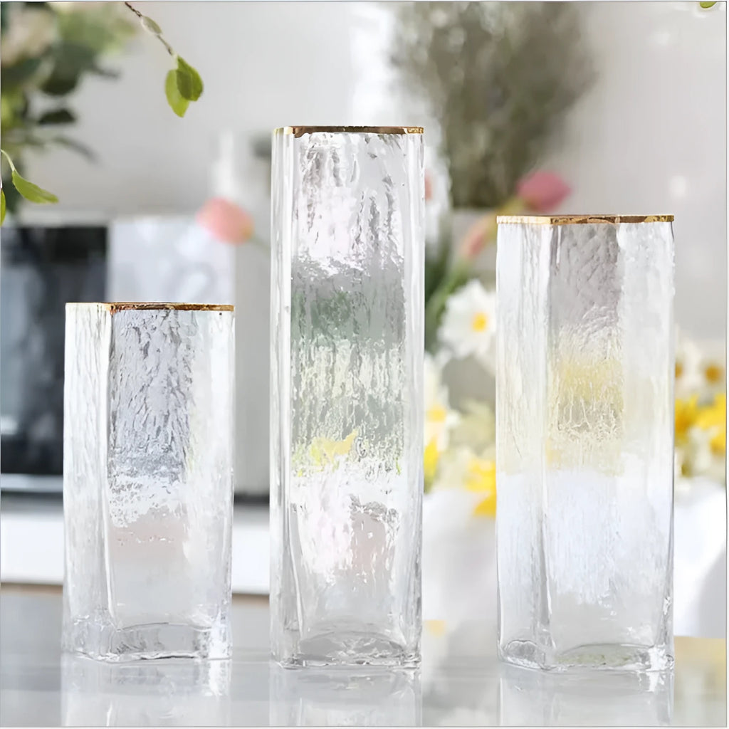 Set of three transparent gold-painted glass vases in 8x20CM, 8x25CM, and 8x30CM on a table