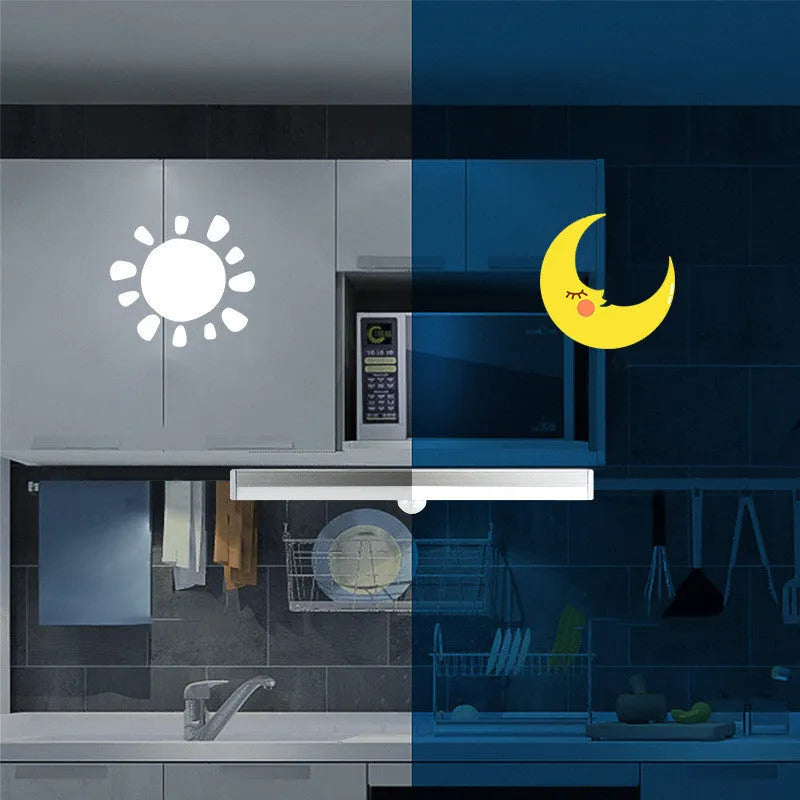 Black battery-powered LED strip light with motion sensor for cabinet or staircase installation.