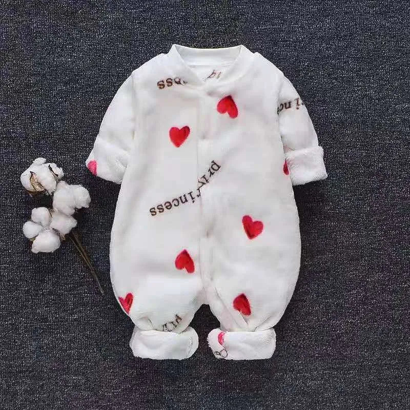 Baby wearing a long sleeve flannel romper with a printed panda pattern in pink and blue.