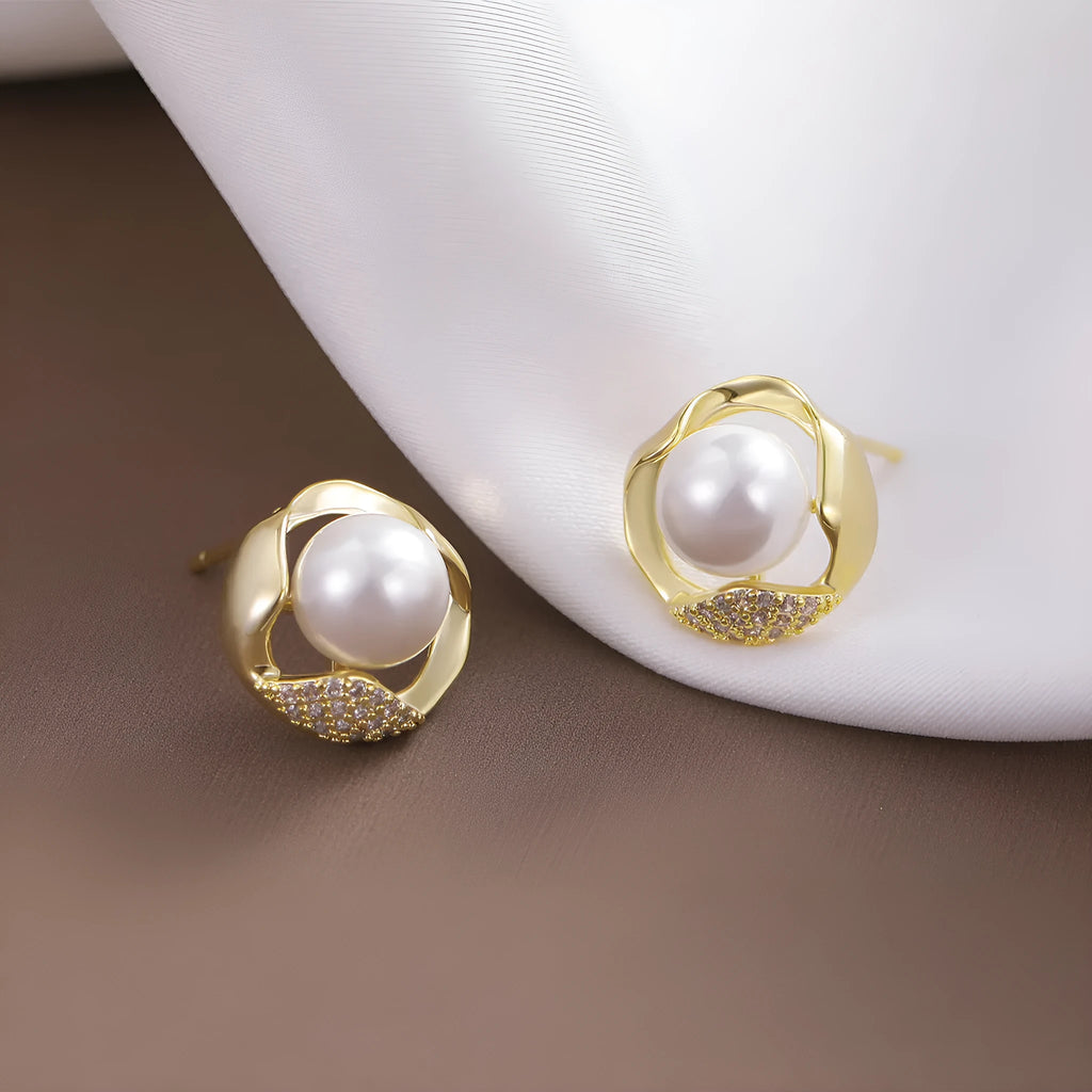 Beizhu zircon gold plated stud earrings in white colour on display