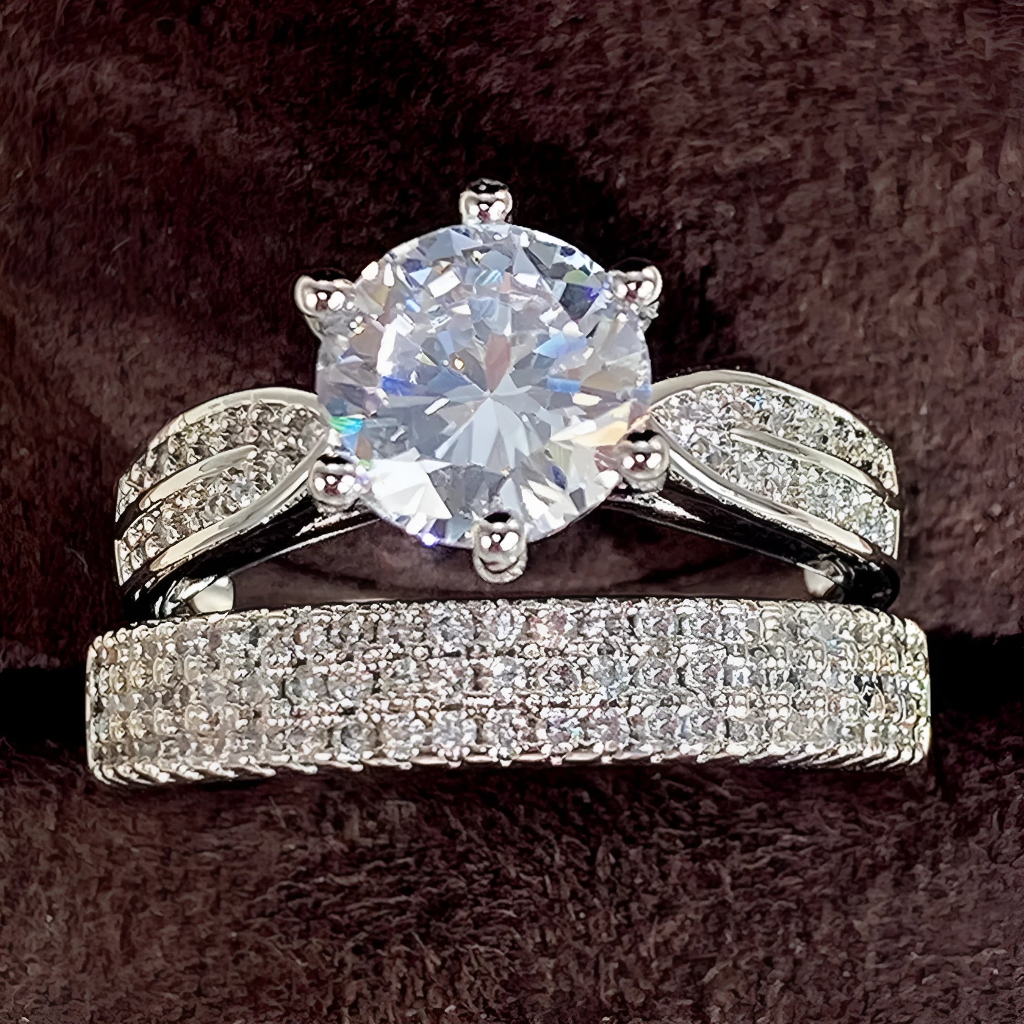 White gold alloy combined ring bracelet with round geometry design on finger.