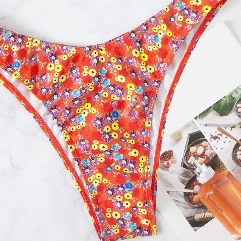 Red floral high-waisted women's one-piece swimsuit with side splits.