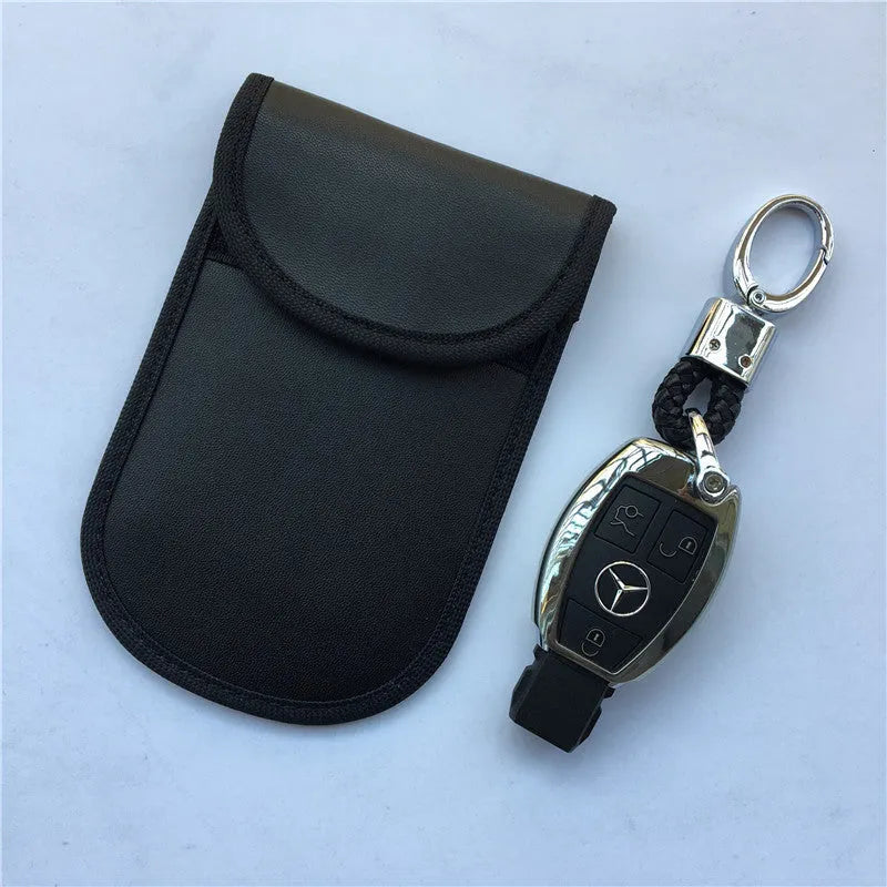Black signal-blocking Faraday pouch for car key fobs, size 20x10 cm, lying flat on a surface