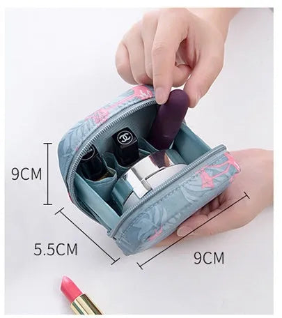 Cloth cube-shaped makeup storage bag in a plain colour on a neutral background.